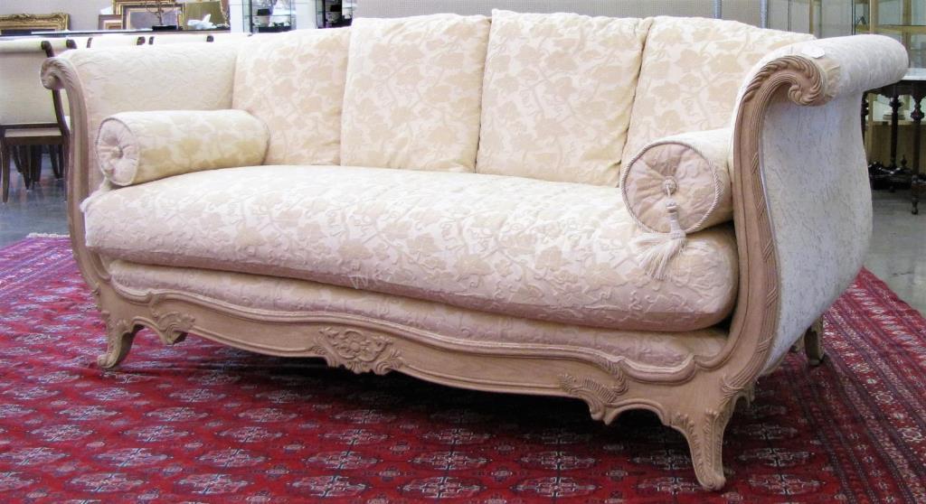 Appraisal: A custom-upholstered sofa by Marge Carson with polychrome carved base