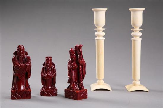 Appraisal: PAIR OF CANDLESTICKS AND THREE ASIAN CARVINGS Ivory candlesticks one