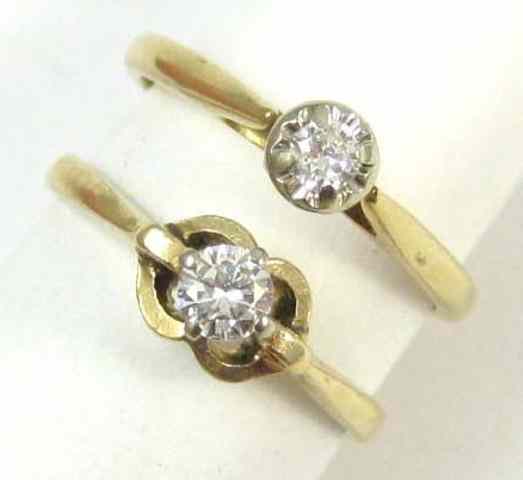 Appraisal: TWO DIAMOND AND FOURTEEN KARAT GOLD RINGS each solitaire ring