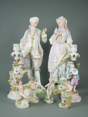 Appraisal: Pair of continental porcelain figures of a lady and a