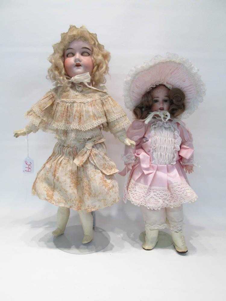 Appraisal: TWO GERMAN BISQUE HEAD GIRL DOLLS each with sleep blue