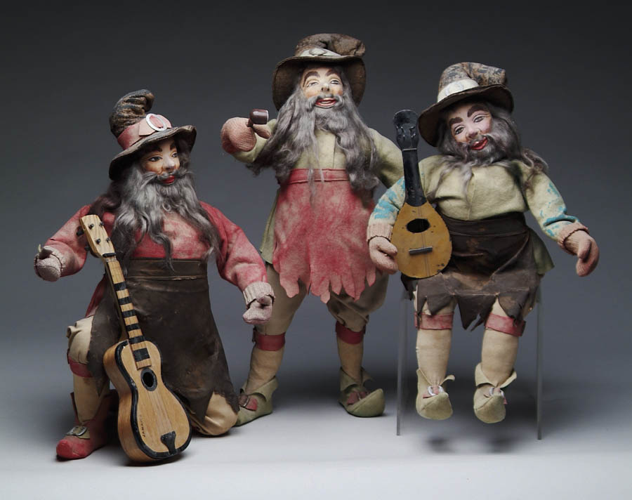 Appraisal: THREE FOLK ART PAPIER-M CH ELVES One holds pipe one