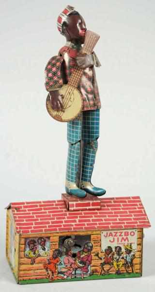 Appraisal: Tin Strauss Jazzbo Jim Roof Dancing Wind-Up Toy Click for