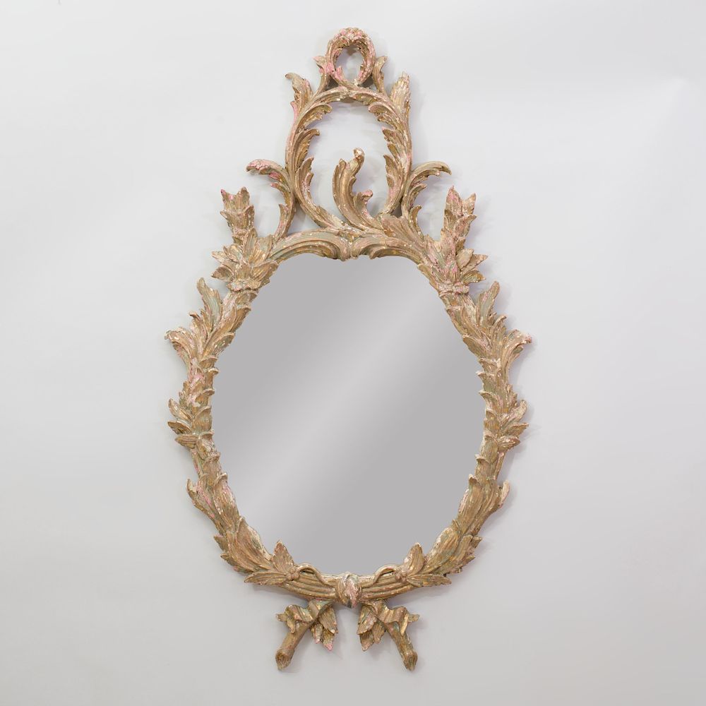 Appraisal: George II Style Painted and Parcel-Gilt Oval Mirror The mirror