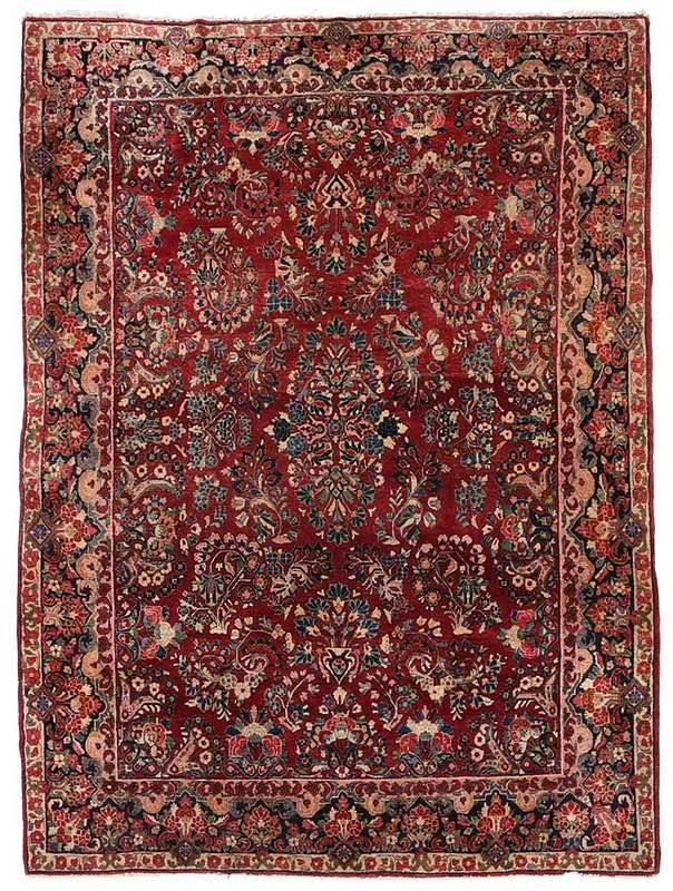 Appraisal: Sarouk Carpet th century red field with floral sprays floral