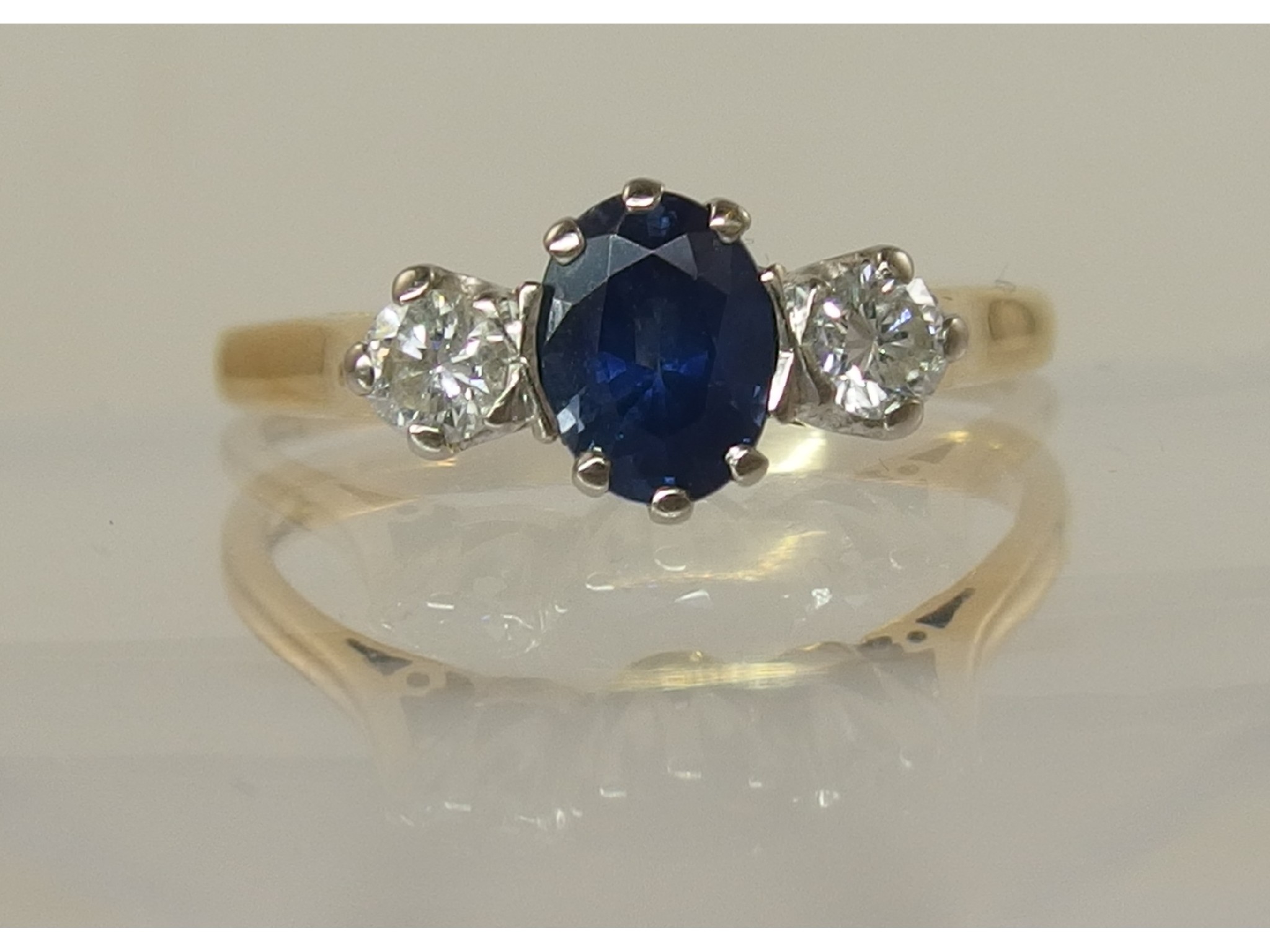 Appraisal: An ct sapphire and diamond three stone ring diamonds approx