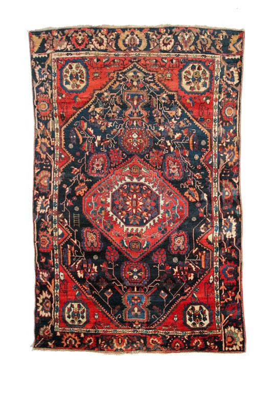 Appraisal: ORIENTAL RUG Persian late th-early th century Blue geometric central