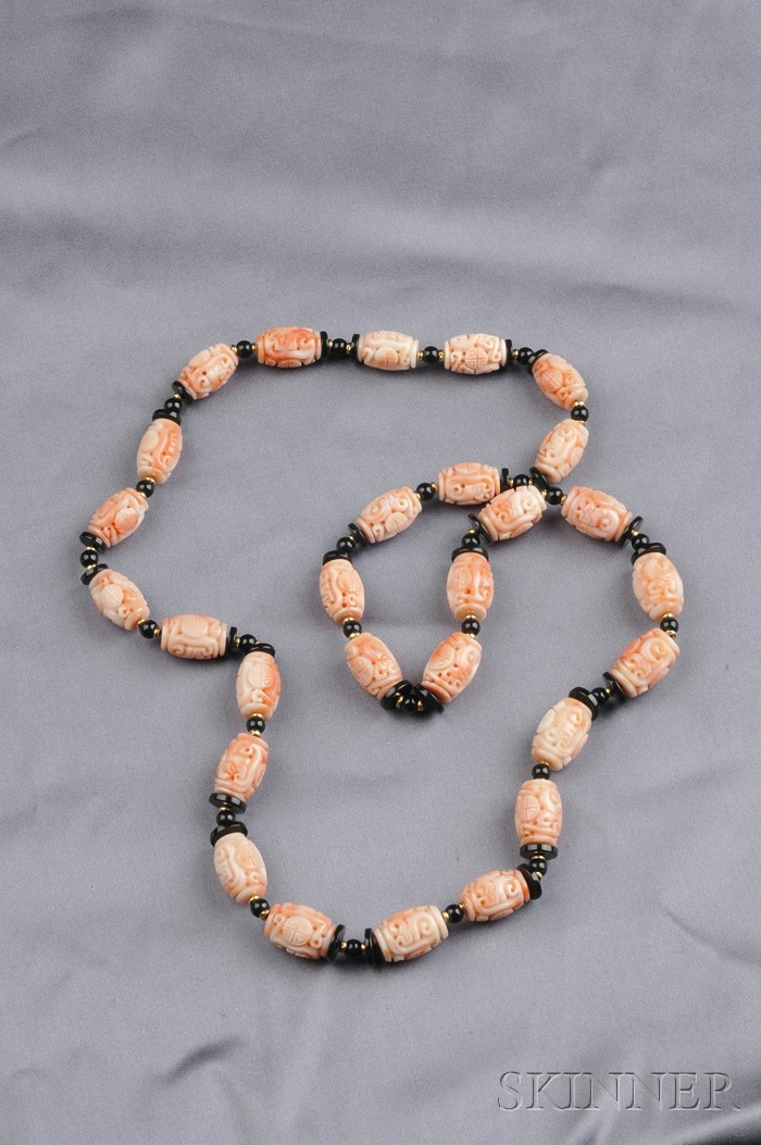 Appraisal: Coral and Black Onyx Bead Necklace composed of twenty-eight carved