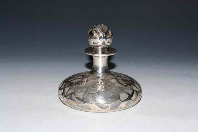 Appraisal: A SILVER AND GLASS OVERLAY PERFUME BOTTLE with pierced orchid