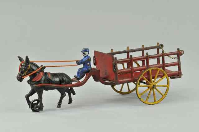 Appraisal: WILKINS MULE DRAWN STAKE WAGON Cast iron open stake wagon