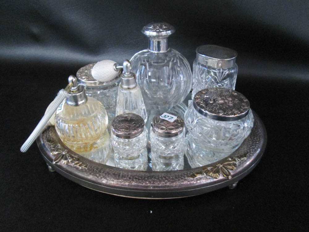 Appraisal: ASSEMBLED VANITY SET nine pieces comprised of sterling silver lidded