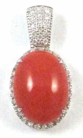 Appraisal: CORAL DIAMOND AND FOURTEEN KARAT GOLD PENDANT round-cut diamonds are