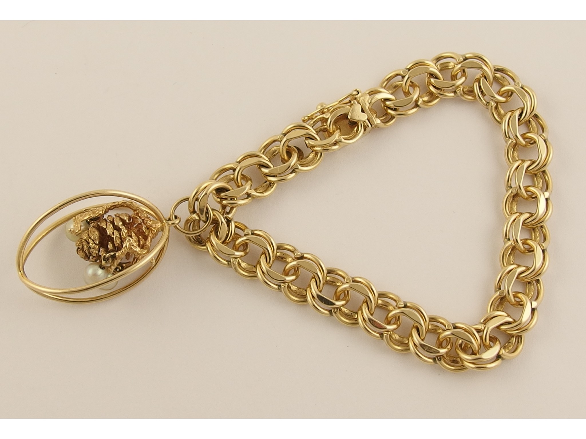 Appraisal: A ct double curb bracelet with an attached yellow metal