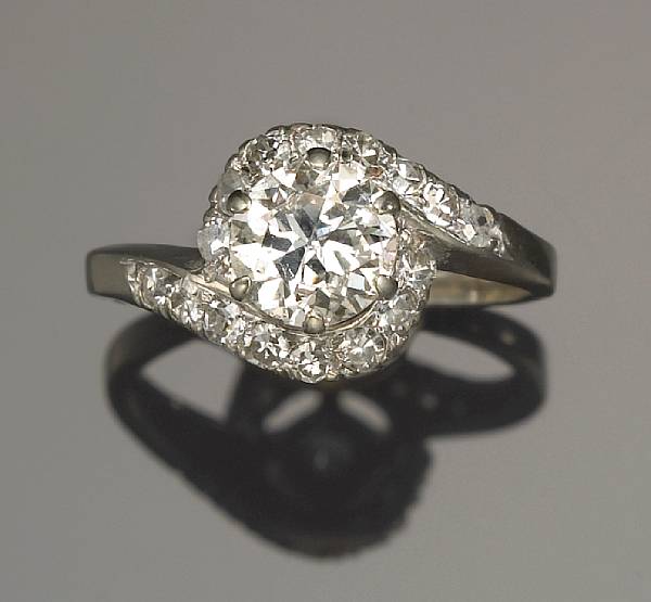 Appraisal: A diamond ring centering a transitional-cut diamond weighing approximately carat