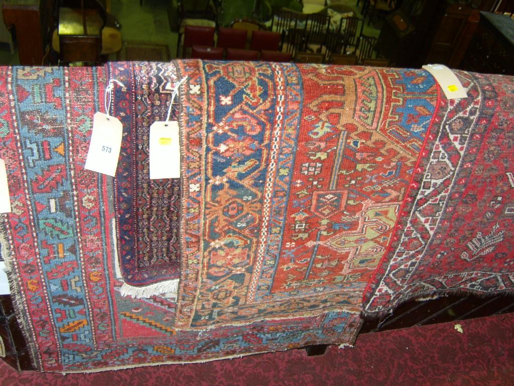 Appraisal: A Persian rug with red ground field and blue medallion