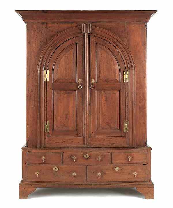 Appraisal: Lancaster Pennsylvania walnut schrank ca the arched raised panel doors