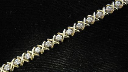 Appraisal: karat yellow gold and diamond braceletThirty-two round cut diamonds approximately