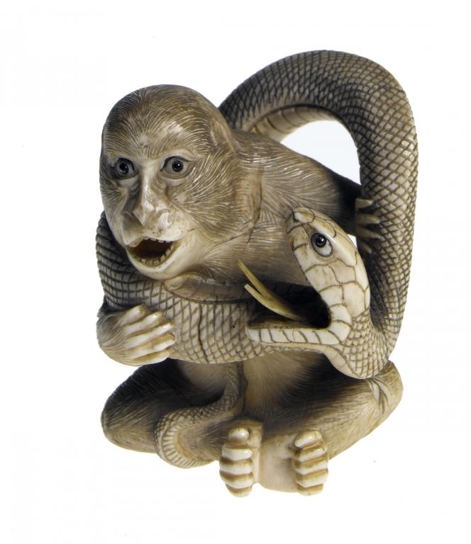 Appraisal: AN IVORY OKIMONO OF AN APE AND SNAKE both with