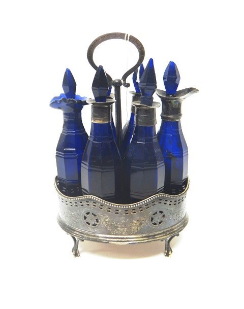 Appraisal: A silver oval six bottle cruet frame with pierced and