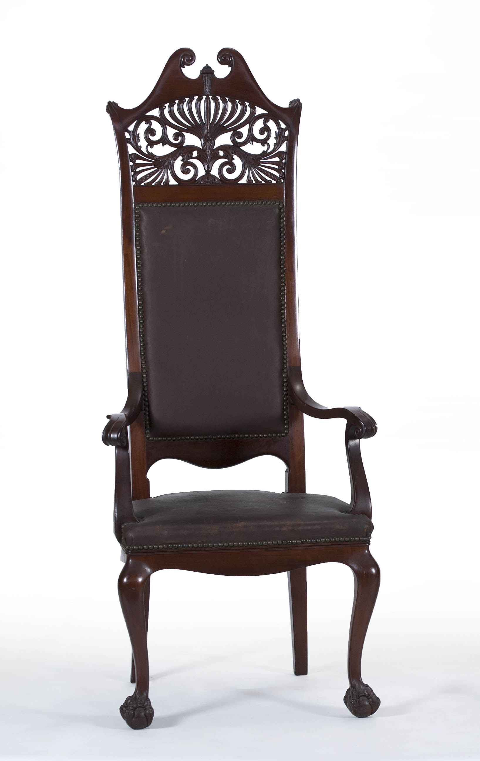 Appraisal: EARLY TH CENTURY HIGHBACK ARMCHAIR in mahogany with carved crest