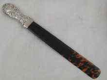 Appraisal: A silver handled tortoiseshell page turner Birmingham cm long