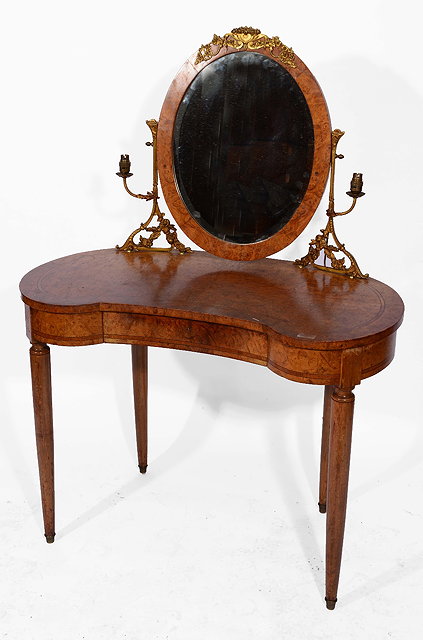 Appraisal: A FRENCH BURR WALNUT KIDNEY SHAPED DRESSING TABLE with swing