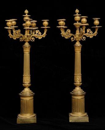 Appraisal: PAIR OF EMPIRE-STYLE GILT-BRONZE FIVE-LIGHT CANDELABRA Each reeded stem with