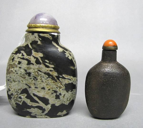 Appraisal: Two snuff bottles The first carved from chalcedony with abstract