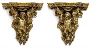 Appraisal: ITALIAN GILTWOOD PUTTI CUPID WALL BRACKETS pair Italian giltwood wall