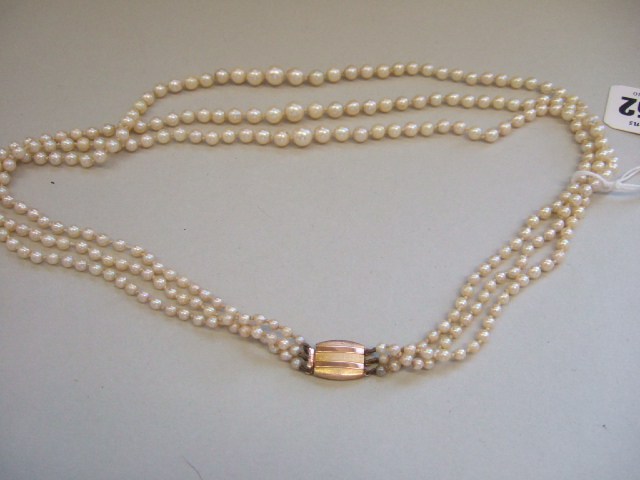 Appraisal: A three row necklace of graduated cultured pearls on a