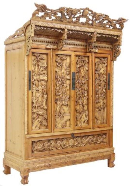 Appraisal: Chinese elaborately carved armoire th c shaped dragon crest over