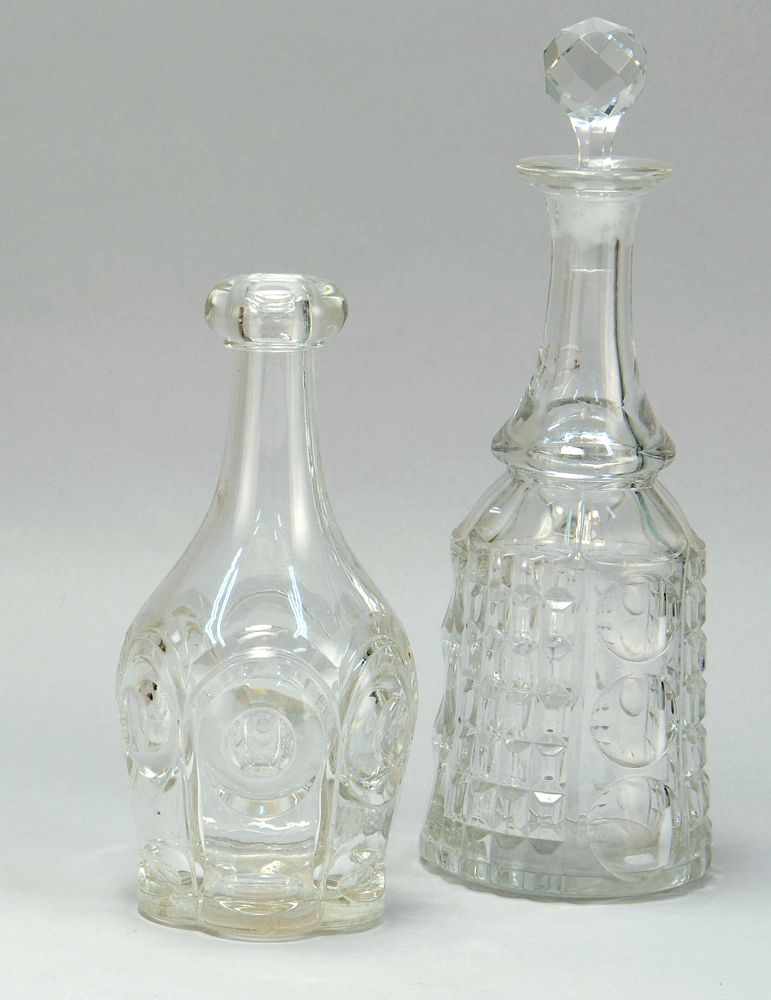 Appraisal: TWO CLEAR FLINT GLASS DECANTERS Mid- th CenturyOne in Bull's-Eye