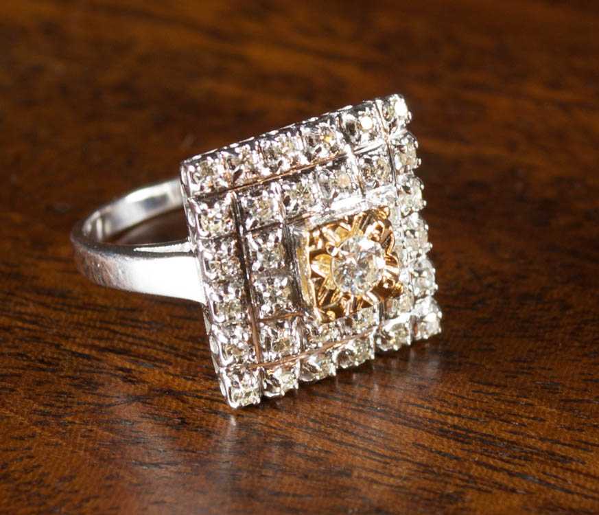 Appraisal: DIAMOND AND FOURTEEN KARAT GOLD RING The white gold ring