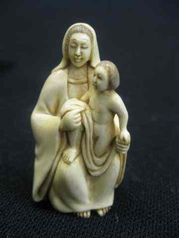 Appraisal: Carved Ivory Netsuke of Mother Child seated '' tall signed