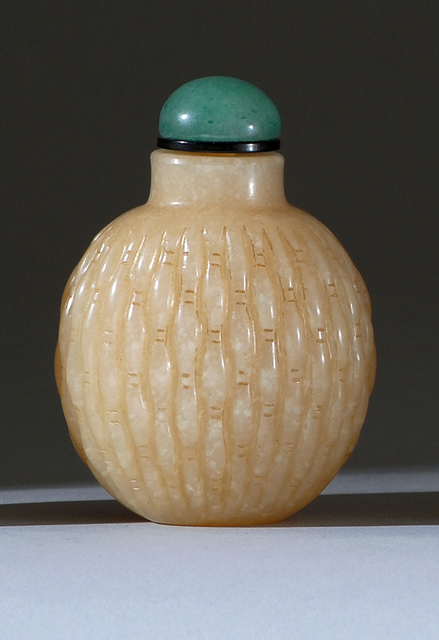 Appraisal: PALE RUSSET JADE SNUFF BOTTLE th CenturyIn ovoid form with