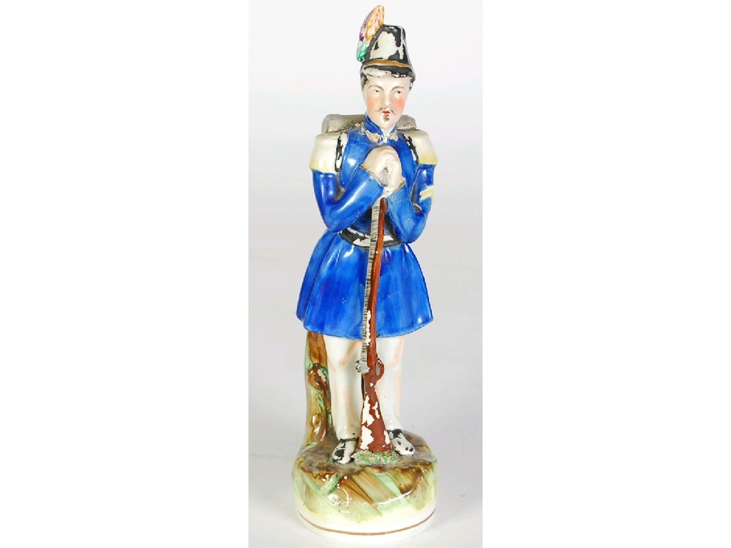 Appraisal: NINETEENTH CENTURY STAFFORDSHIRE POTTERY FIGURE OF A NAPOLEONIC SOLDIER modelled