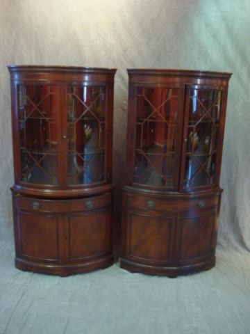 Appraisal: Pair of mahogany curved glass corner cabinets Dimensions x high