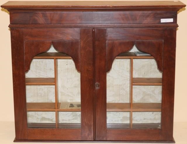 Appraisal: TH CENTURY MINIATURE HANGING MAHOGANY CABINETWITH ARCHED GOTHIC DOORS MULTI