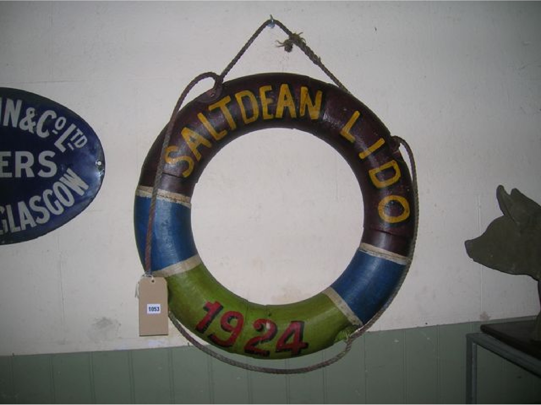 Appraisal: A contemporary lifebuoy ring with painted finish and lettering reading