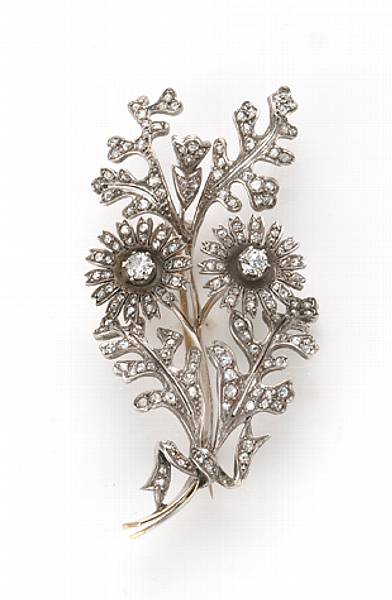 Appraisal: A diamond and silver convertible brooch-earrings with removable flowers to