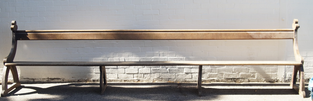 Appraisal: An oak ecclesiastical church pew having slat board seat with