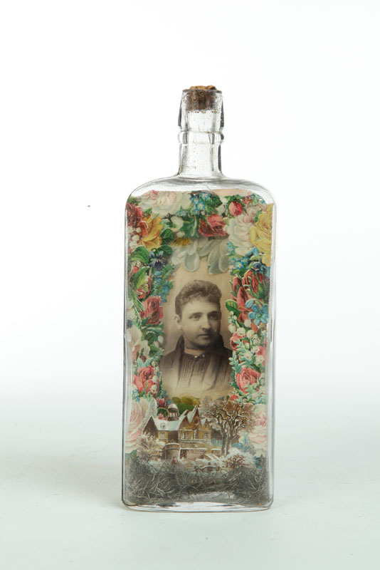 Appraisal: BOTTLE WHIMSEY American early th century glass wood photograph printed