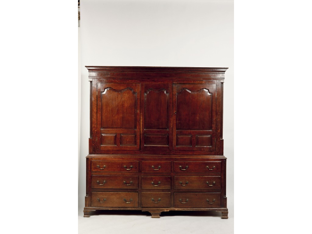 Appraisal: A LARGE GEORGE III OAK LIVERY HOUSEKEEPERS CUPBOARD the upper