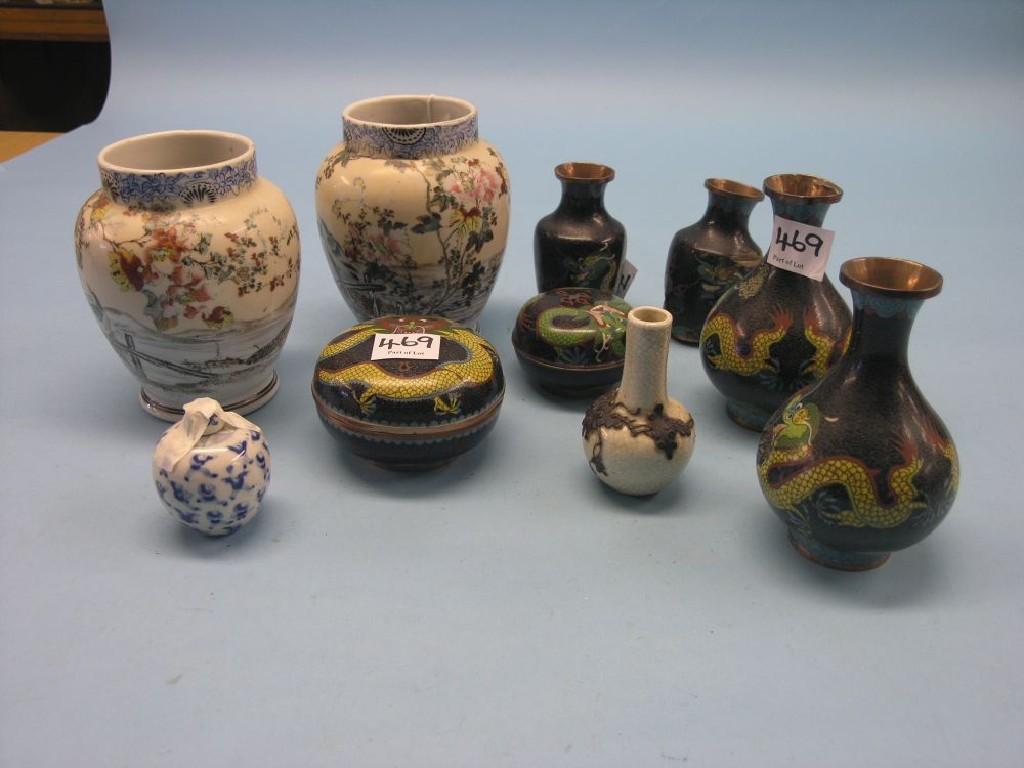 Appraisal: A pair of Japanese porcelain vases ovoid-shape continuously painted with