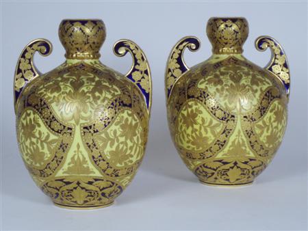 Appraisal: A pair of late th century Derby twin handled vases