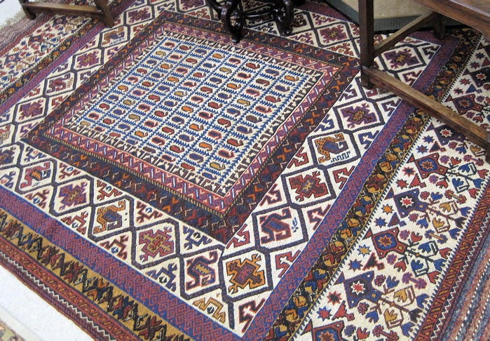 Appraisal: AFGHAN SOUMAK FLATWEAVE CARPET centering a boteh-filled rectangular panel within