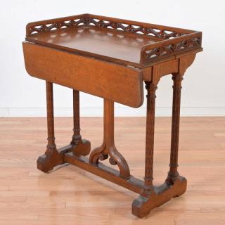 Appraisal: Gothic Revival carved oak writing table th c galleried top