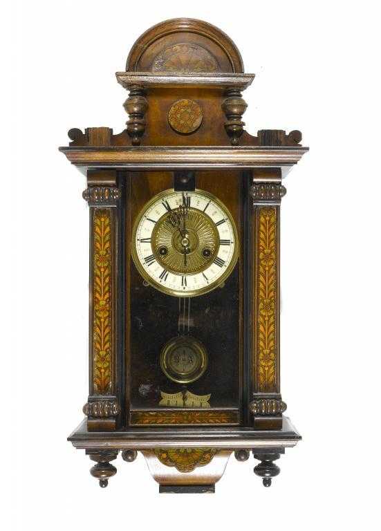 Appraisal: A GERMAN OR AUSTRIAN INLAID WALNUT WALL CLOCK the embossed