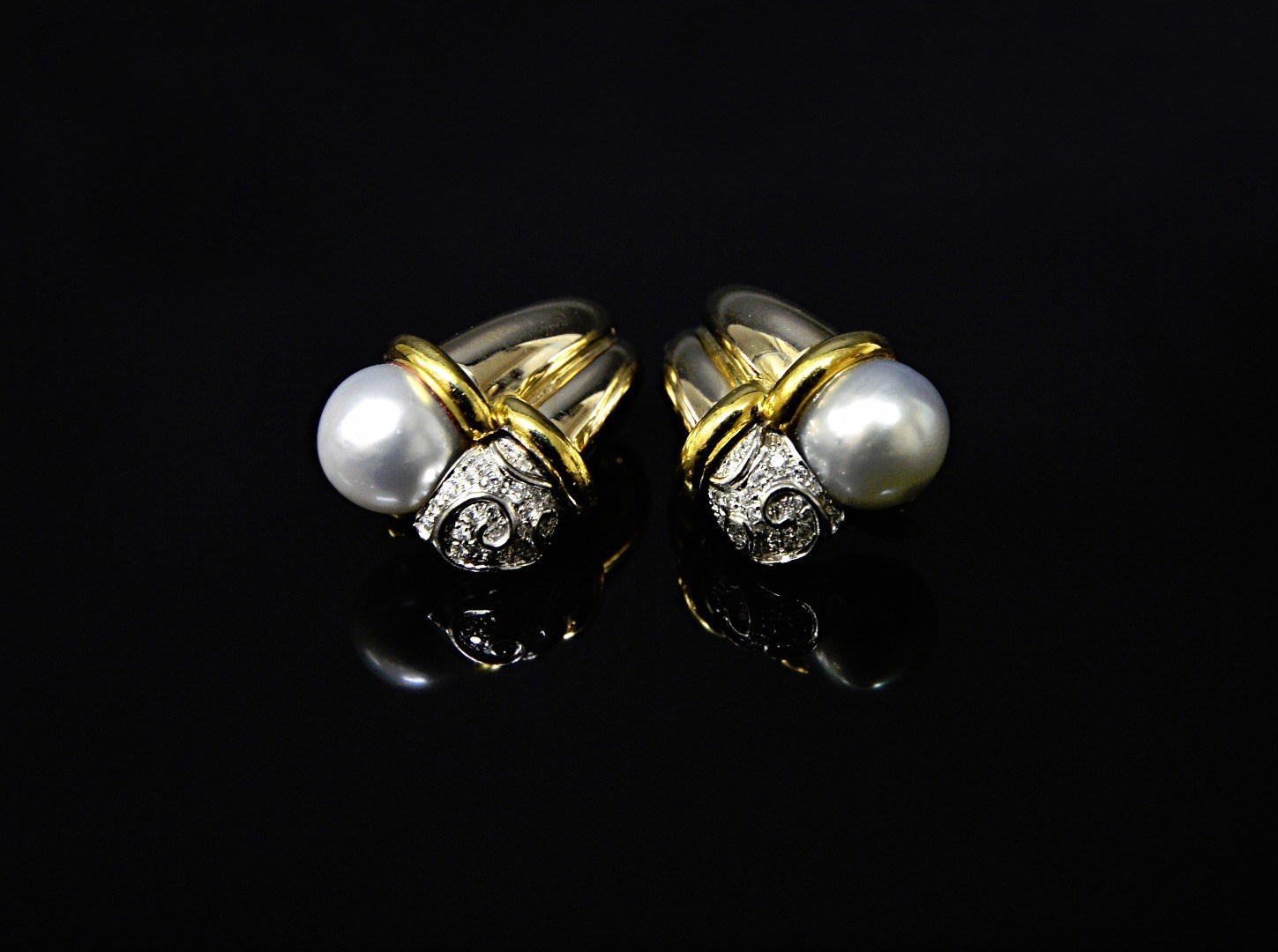 Appraisal: A pair of gold diamond and cultured pearl set earclips