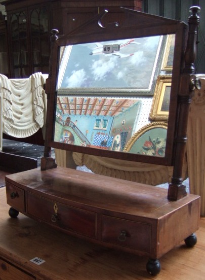 Appraisal: A th century mahogany swing frame toilet mirror the bowfront